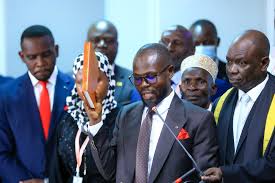 Nalukoola’s legal teams ask    court  dismiss claims of bribing witnesses made by Nambi in the election petition.